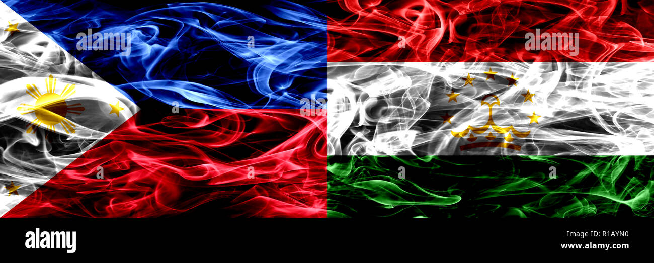 Philippines vs Tajikistan, Tajikistani smoke flags placed side by side. Thick abstract colored silky smoke flags Stock Photo