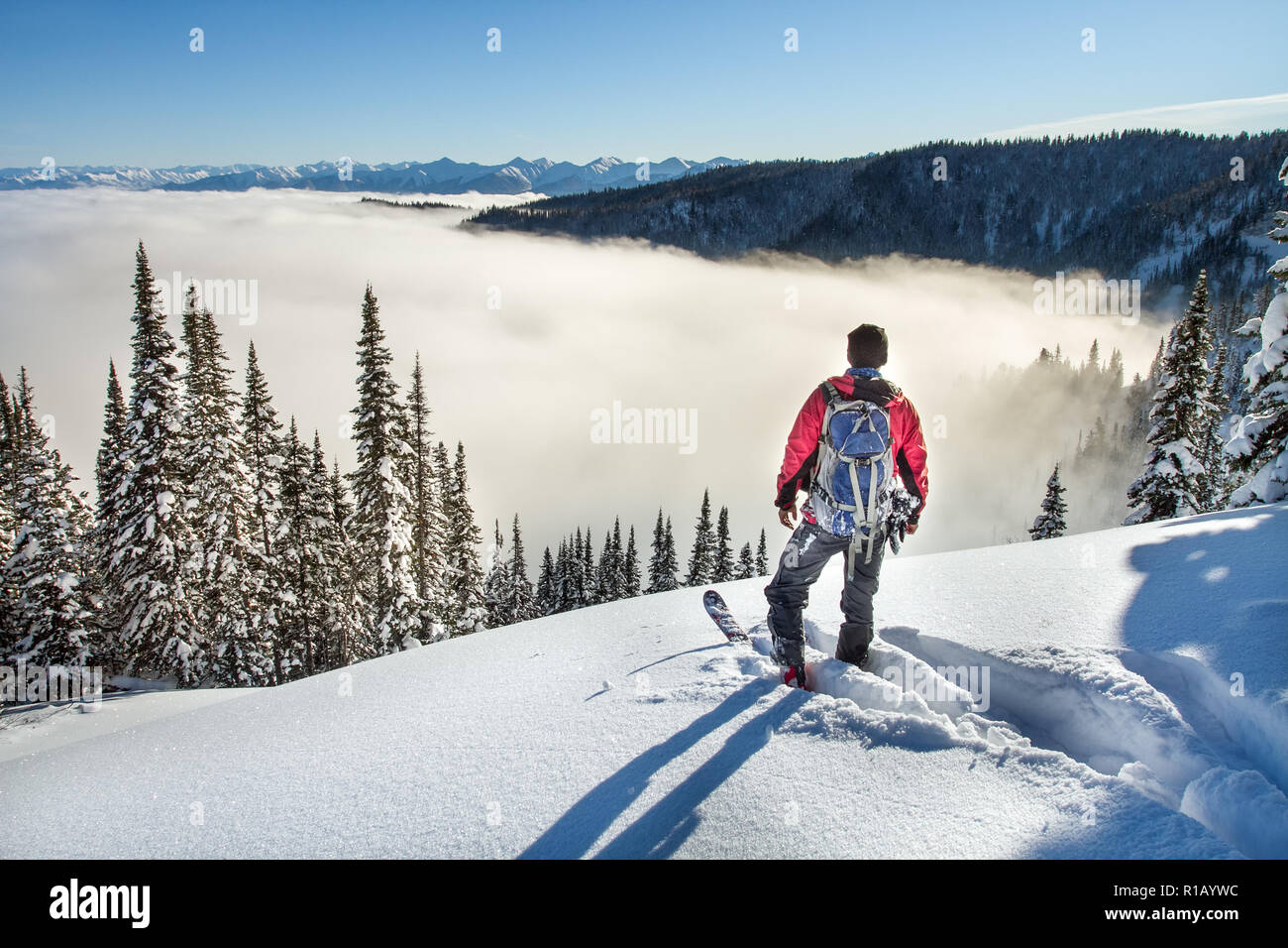 A skier walks in the mountains Stock Photo