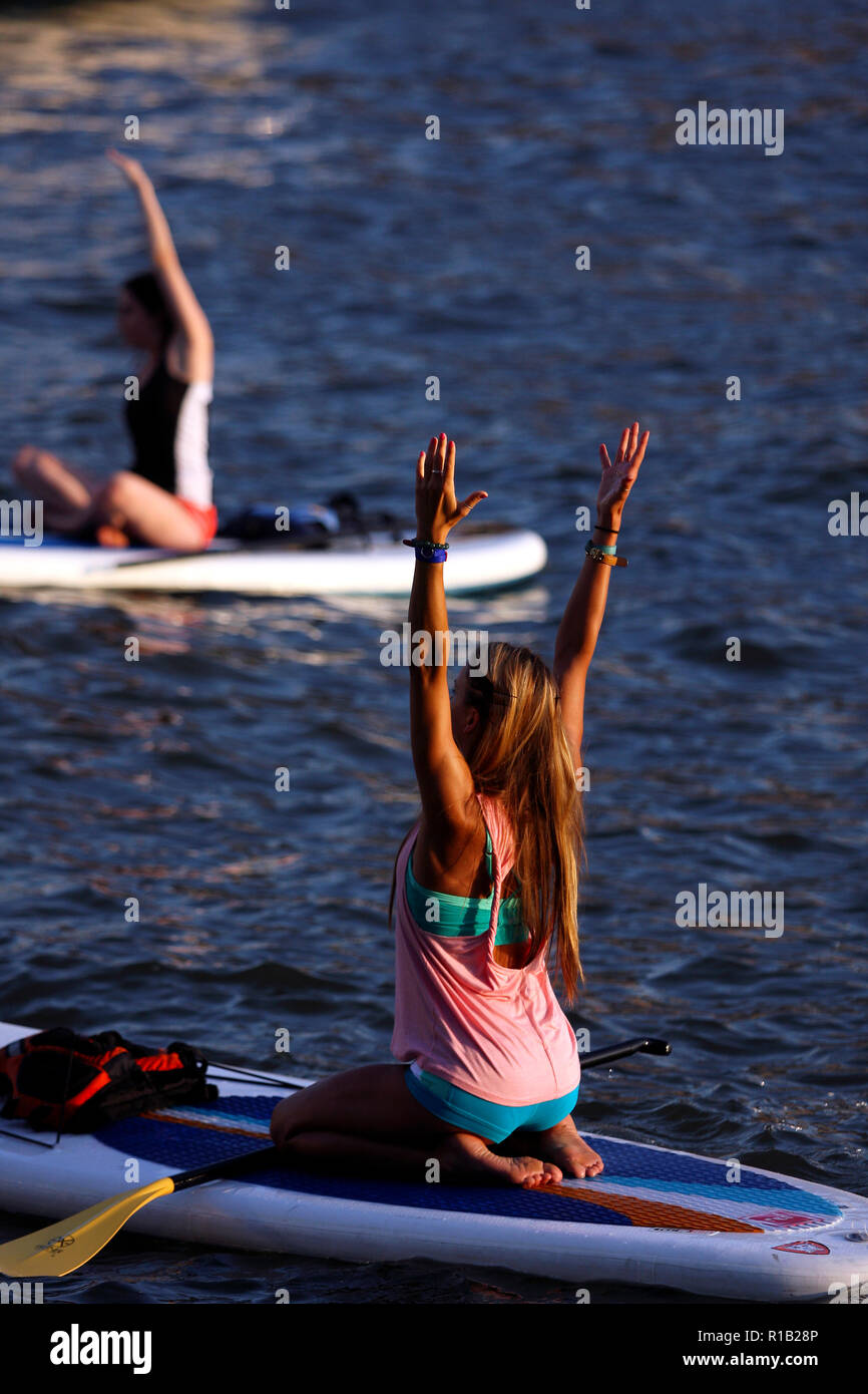 Paddleboard yoga class on the Hudson river in New York City Stock Photo ...