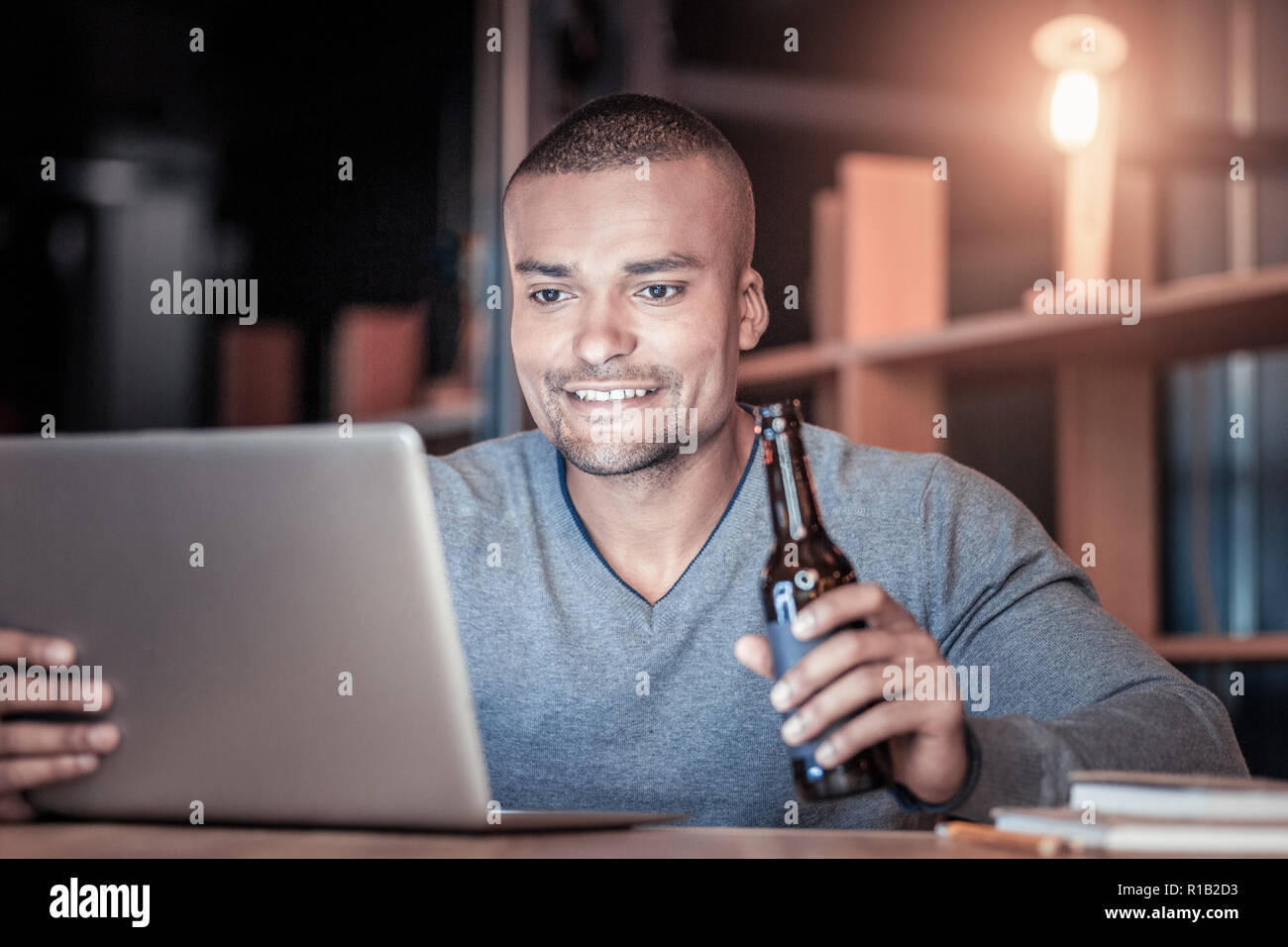 Concentrated young programmer checking news Stock Photo