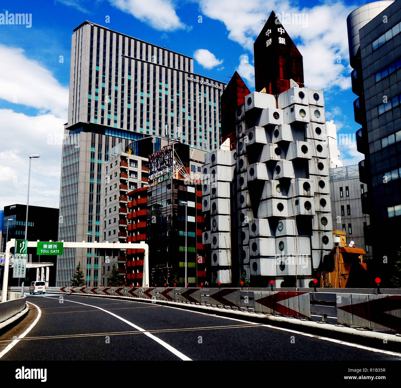 Driving on tollway past Nakagin Capsule Tower, Ginza, Tokyo, Japan. No PR Stock Photo