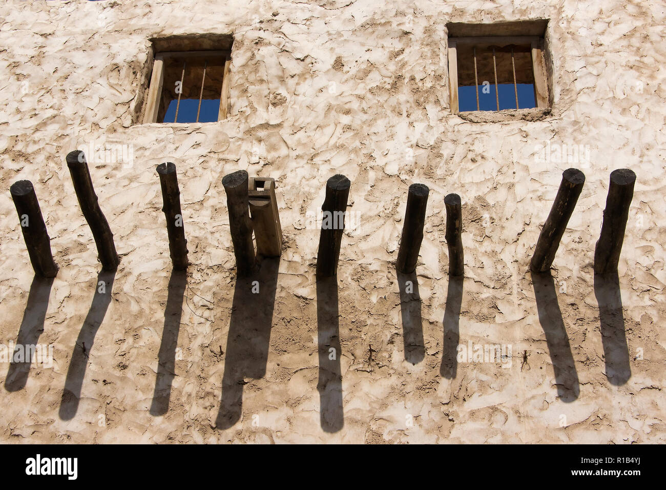 Old arabic house exterior with two windows close up Stock Photo Alamy