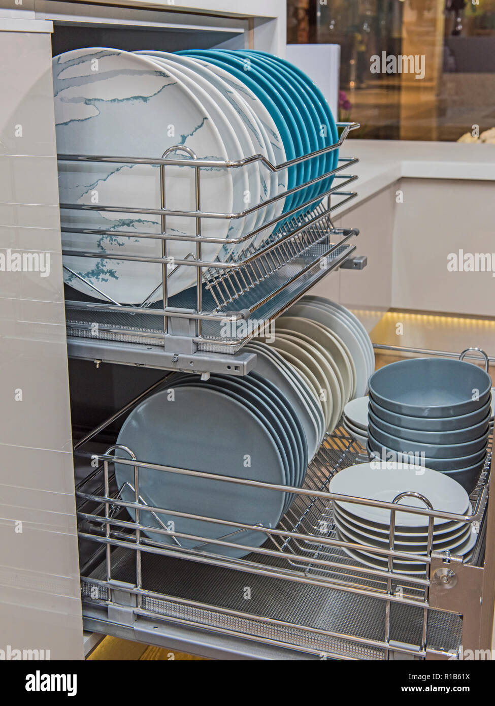 Crockery in kitchen cupboard hi-res stock photography and images - Alamy