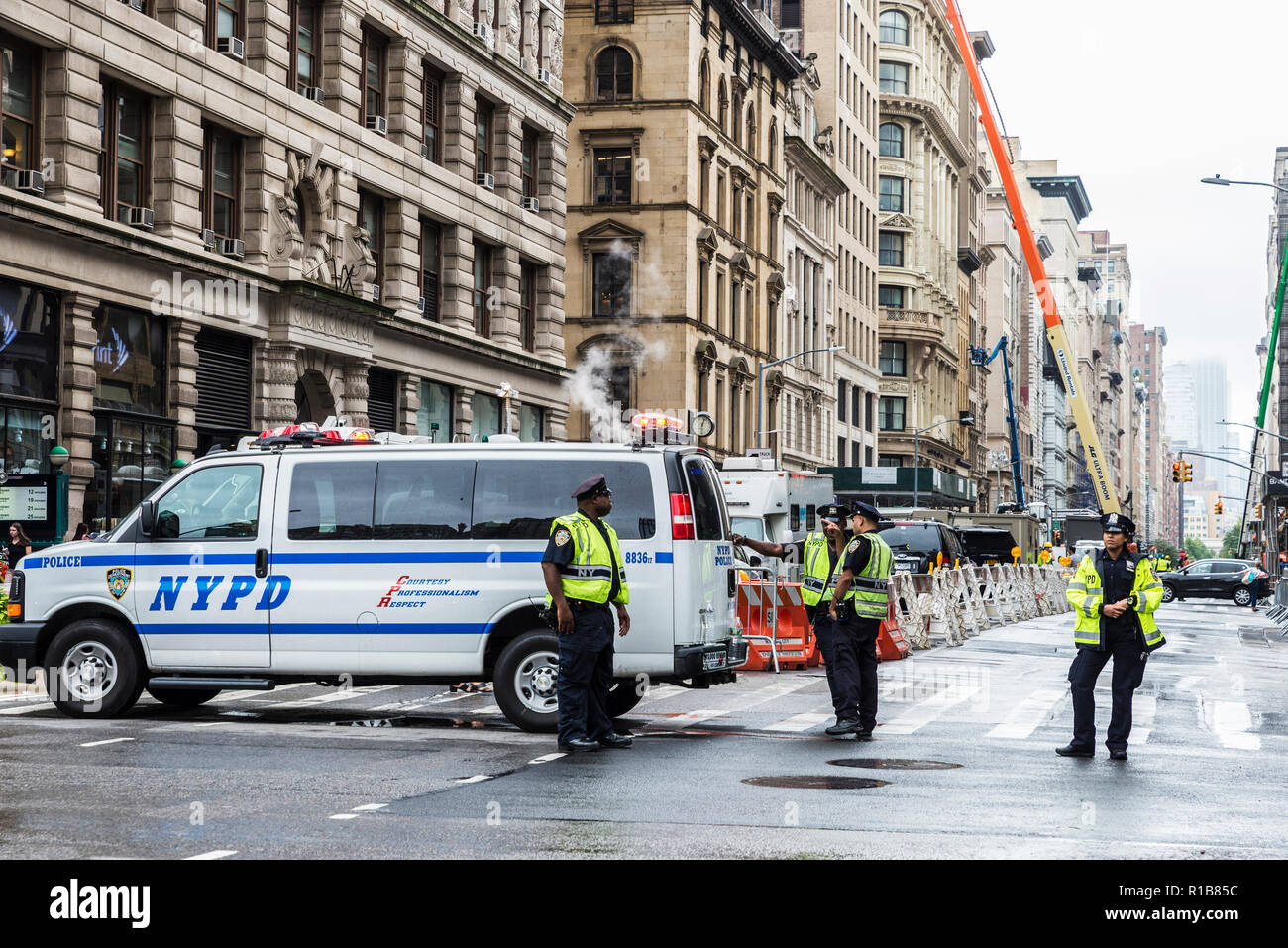 New York City, USA - July 25, 2018: Four police stopping the traffic ...