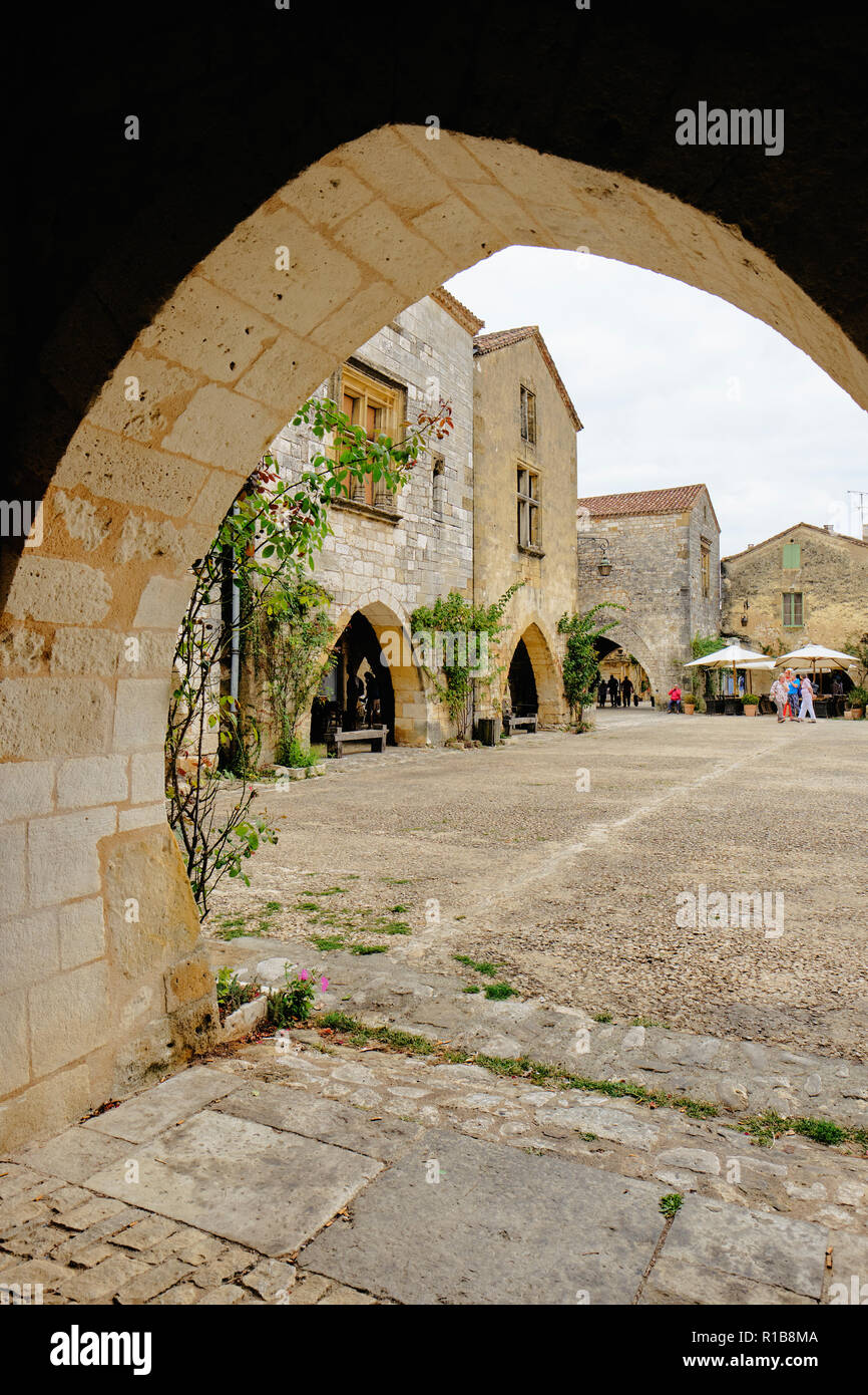 The medieval main square of Monpazier in the Dordogne France. Stock Photo