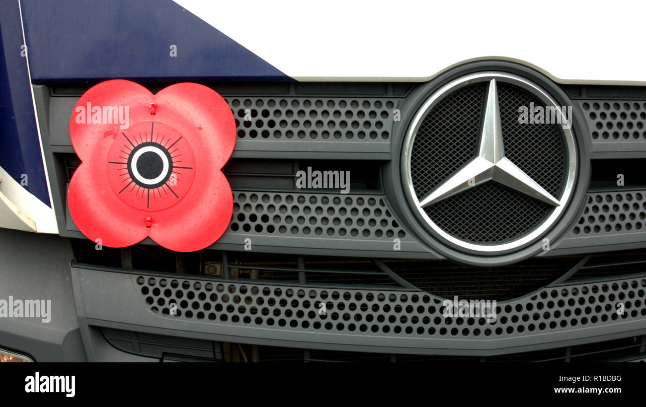 red poppy remembrance day on Mercedes car grill German and British first world war symbol concept Stock Photo