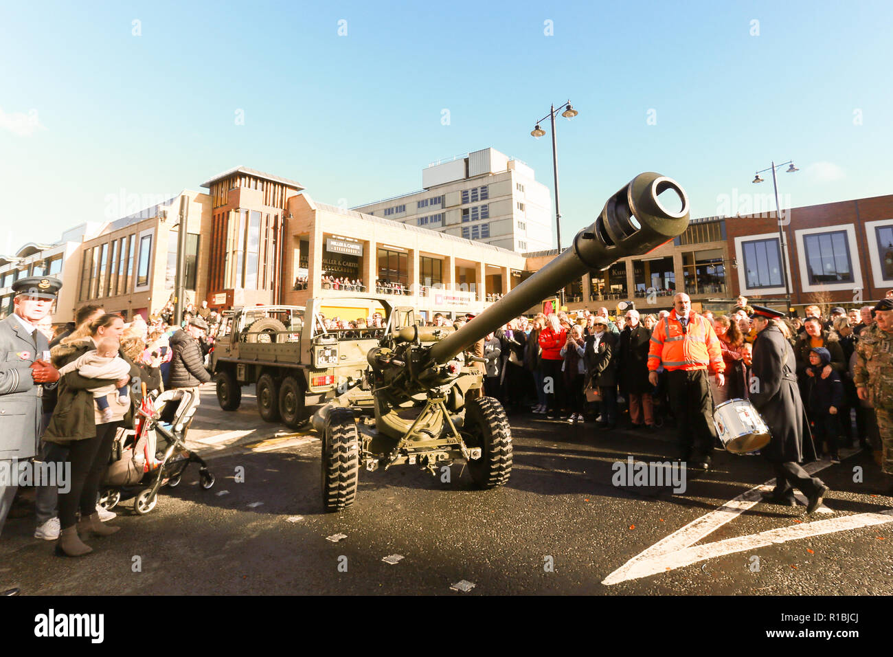 Worcester, UK. 11th November, 2018. The end of the First World War is commemorated at Worcester Cathedral. A modern gun is towed through the parade. Peter Lopeman/Alamy Live News Stock Photo
