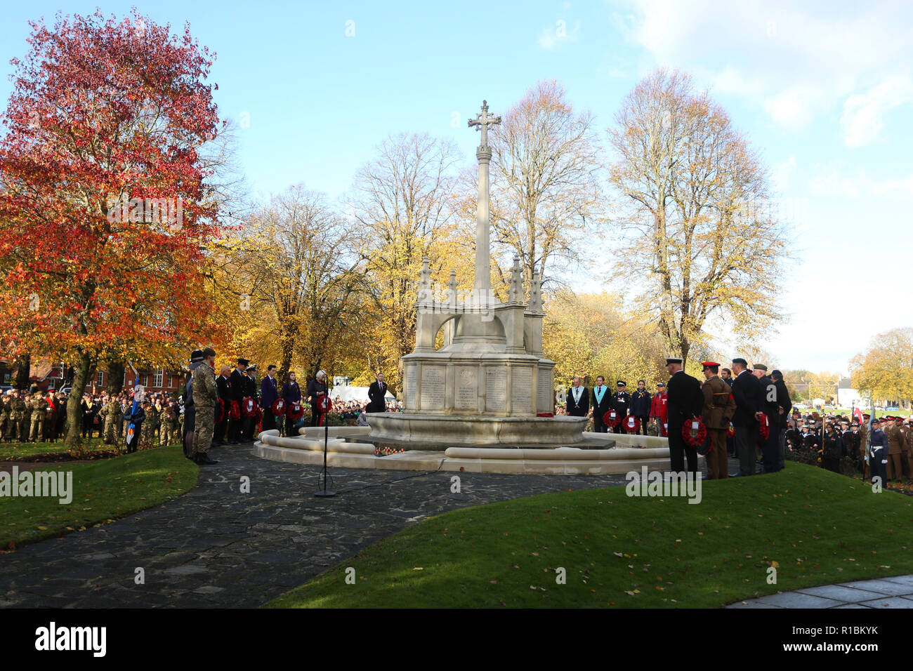Chichester Remembrance, West Sussex, UK. Gillian Keegan, MP for the Chichester Constituency pictured amongst other VIPs at Litten Gardens, St Pancras Road, Chichester for the Service of Remembrance. 11th November 2018. The City Council has commissioned a special sculpture that will be located in a newly designed Garden of Reflection and Reconciliation located on the North side of Litten Gardens. In the adjacent New Park Road, the Garrison Artillery Volunteers will be manning a World War One 18 pdr gun in New Park Road and firing a barrage of ten rounds in the moments immediately preceding the  Stock Photo