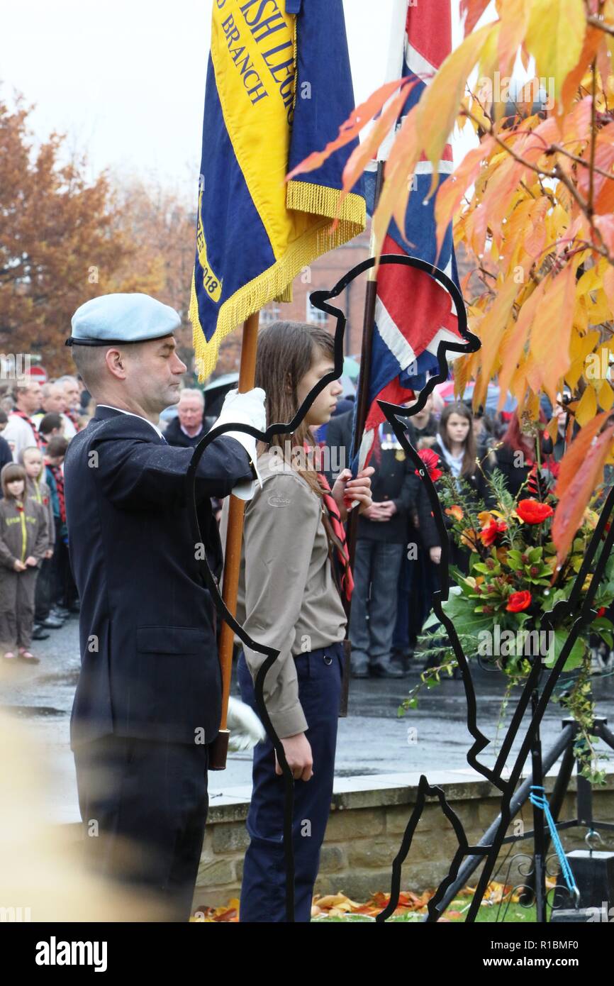 100 Years Armistice Remembrance Day Ceremony in Easingwold Market Square, North Yorkshire, England, UK. A remembrance service held every year in the North Yorkshire Market Town and attended by local groups and the general public. Despite the rain this year the Armistice service was very well supported to commemorate 100 years since the end of World War 1. Stock Photo