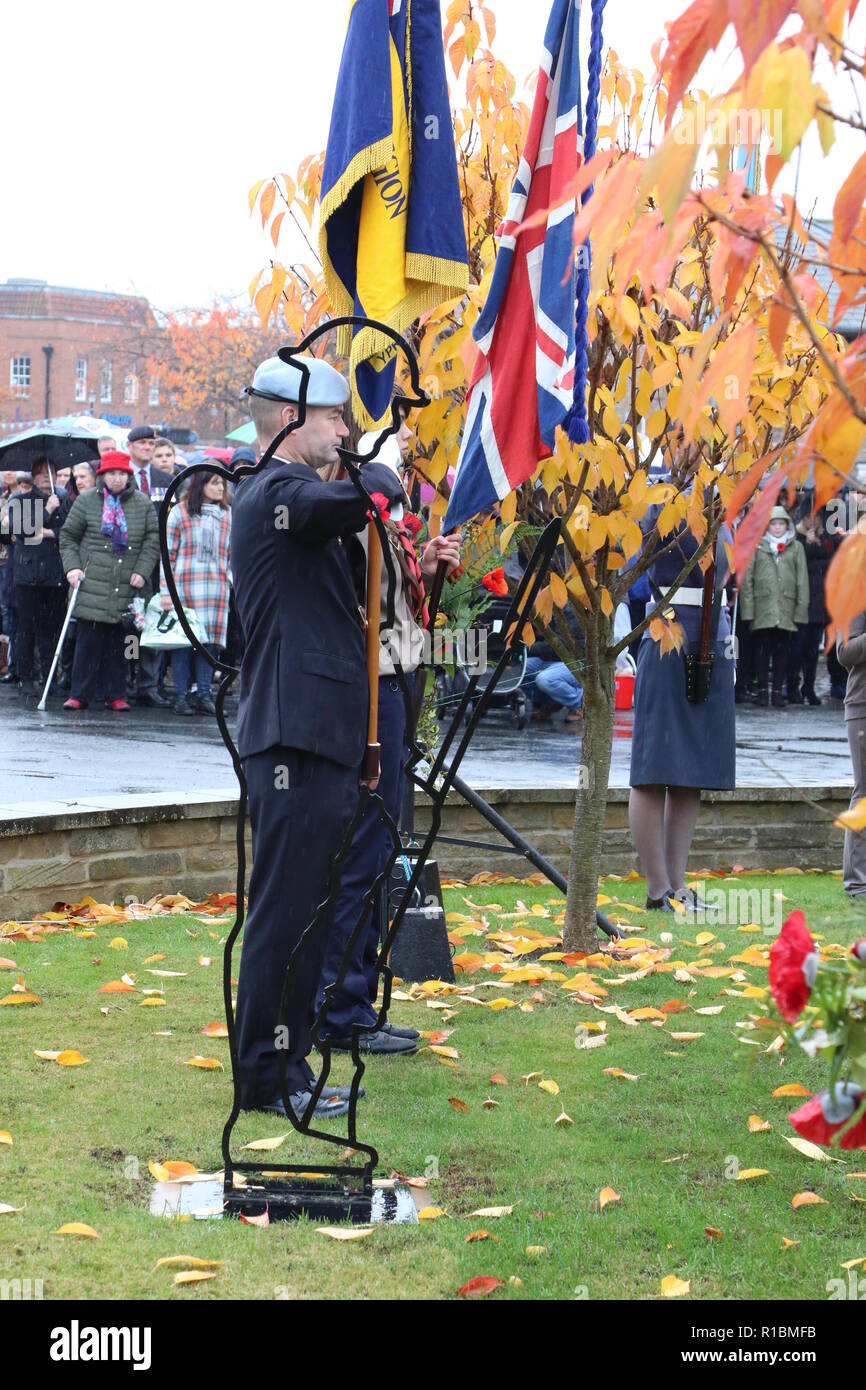 100 Years Armistice Remembrance Day Ceremony in Easingwold Market Square, North Yorkshire, England, UK. A remembrance service held every year in the North Yorkshire Market Town and attended by local groups and the general public. Despite the rain this year the Armistice service was very well supported to commemorate 100 years since the end of World War 1. Stock Photo