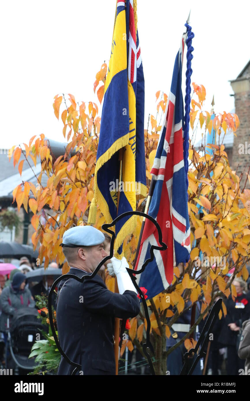 100 Years Armistice Remembrance Day Ceremony in Easingwold Market Square, North Yorkshire, England, UK. A remembrance service held every year in the North Yorkshire Market Town and attended by local groups and the general public. Despite the rain this year the Armistice service was very well supported to commemorate 100 years since the end of World War 1. Stock Photo