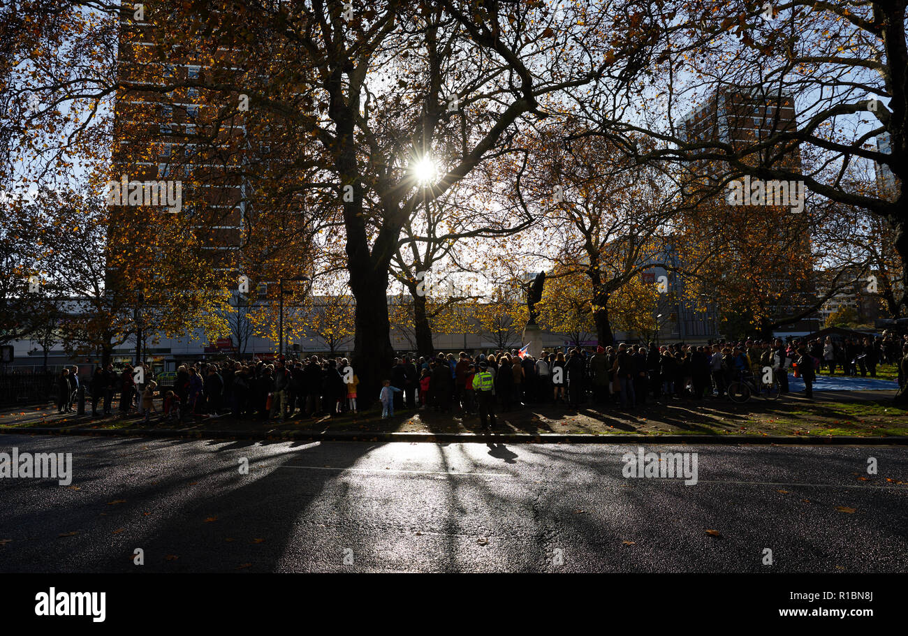 London, UK. - 11 November 2018: People gathered at a remembrance service at the Hammersmith War Memorial on Shepherd's Bush Green on the 100th anniversary since the end of World War One. Credit: Kevin J. Frost/Alamy Live News Stock Photo