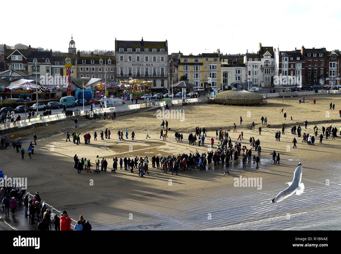 Pages of the Sea. Weymouth beach, Dorset, UK. 11th Nov, 2018. The face of Private Stanley McDougall etched onto the shore at Weymouth Beach as part of Pages of the Sea event, Dorset Credit: Finnbarr Webster/Alamy Live News Stock Photo