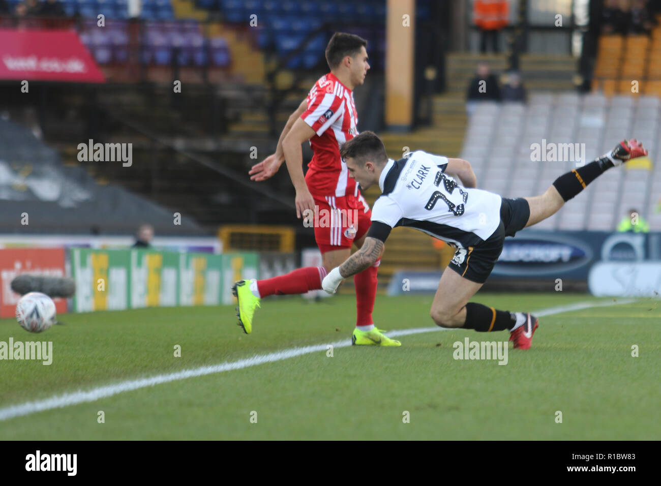 Burslem, Staffordshire, UK. 11th Nov 2018. Port Vale defender Mitchell Clark (23) challenges for the ball  during the The FA Cup first round match between Port Vale and Sunderland at Vale Park, Burslem, England on 11 November 2018. Photo by Jurek Biegus.  Editorial use only, license required for commercial use. No use in betting, games or a single club/league/player publications. Credit: UK Sports Pics Ltd/Alamy Live News Stock Photo