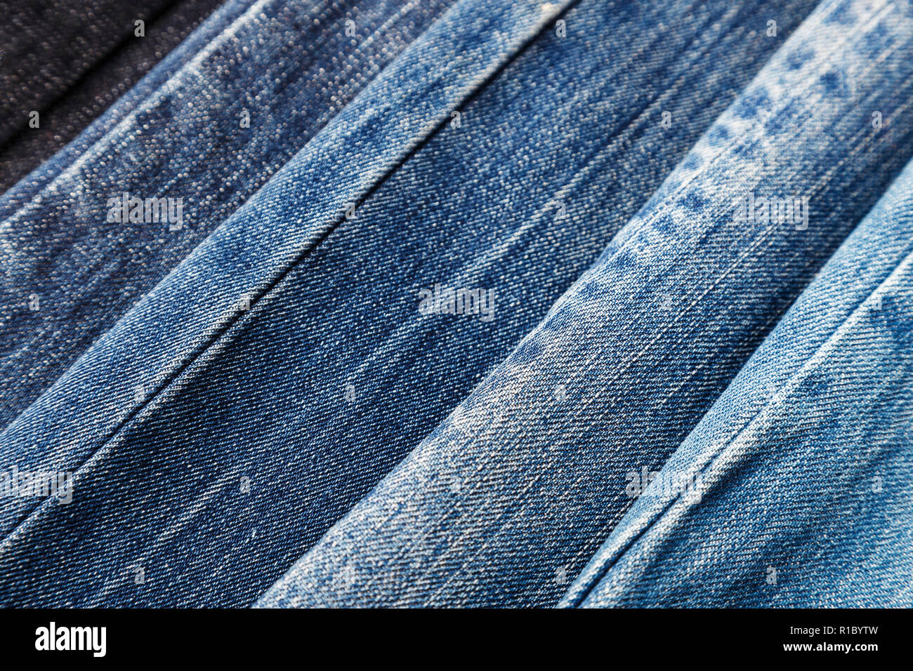 many different colors of denim as background. well visible fabric texture  Stock Photo - Alamy