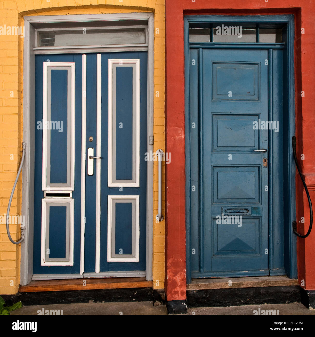 Closeup On Old Doors In Red And Yellow Houses Stock Photo