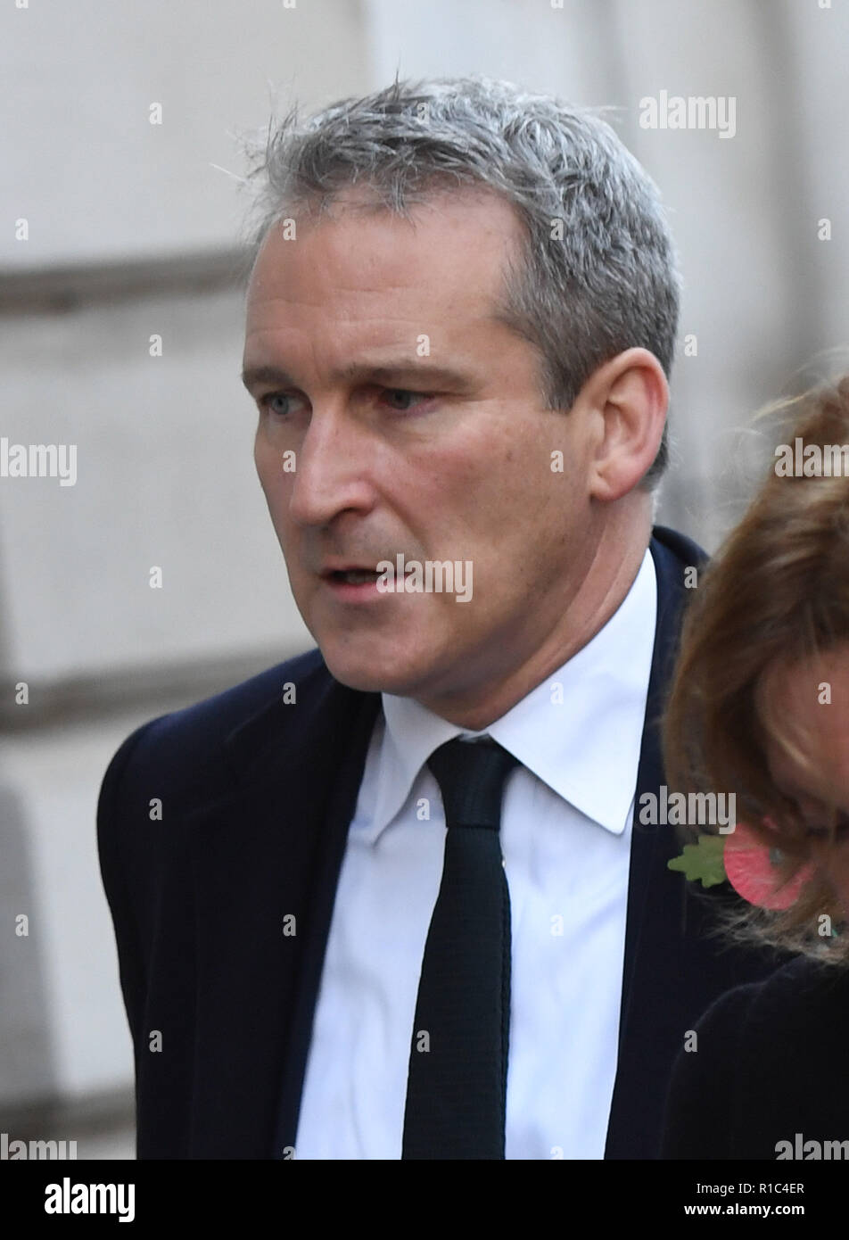 Education Secretary Damian Hinds walks through Downing Street ahead of the remembrance service at the Cenotaph memorial in Whitehall, central London, on the 100th anniversary of the signing of the Armistice which marked the end of the First World War. Stock Photo