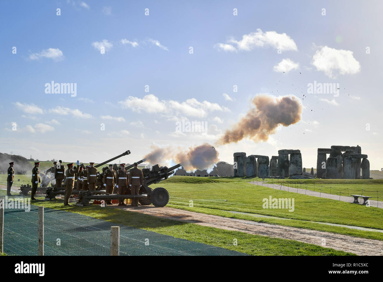 Soldiers from the Royal Artillery man their 105mm light guns at Stonehenge in Wiltshire, as they fire 100 rounds before falling silent as the clock strikes 11am on the 100th anniversary of the signing of the Armistice which marked the end of the First World War. Stock Photo