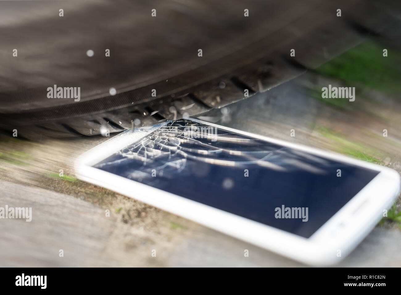 Phone run over by car Stock Photo Alamy