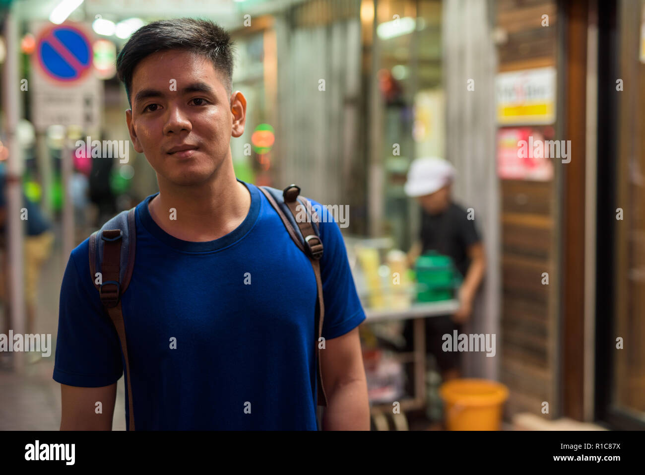 Young Asian tourist man exploring at Chinatown in Bangkok Thailand Stock Photo