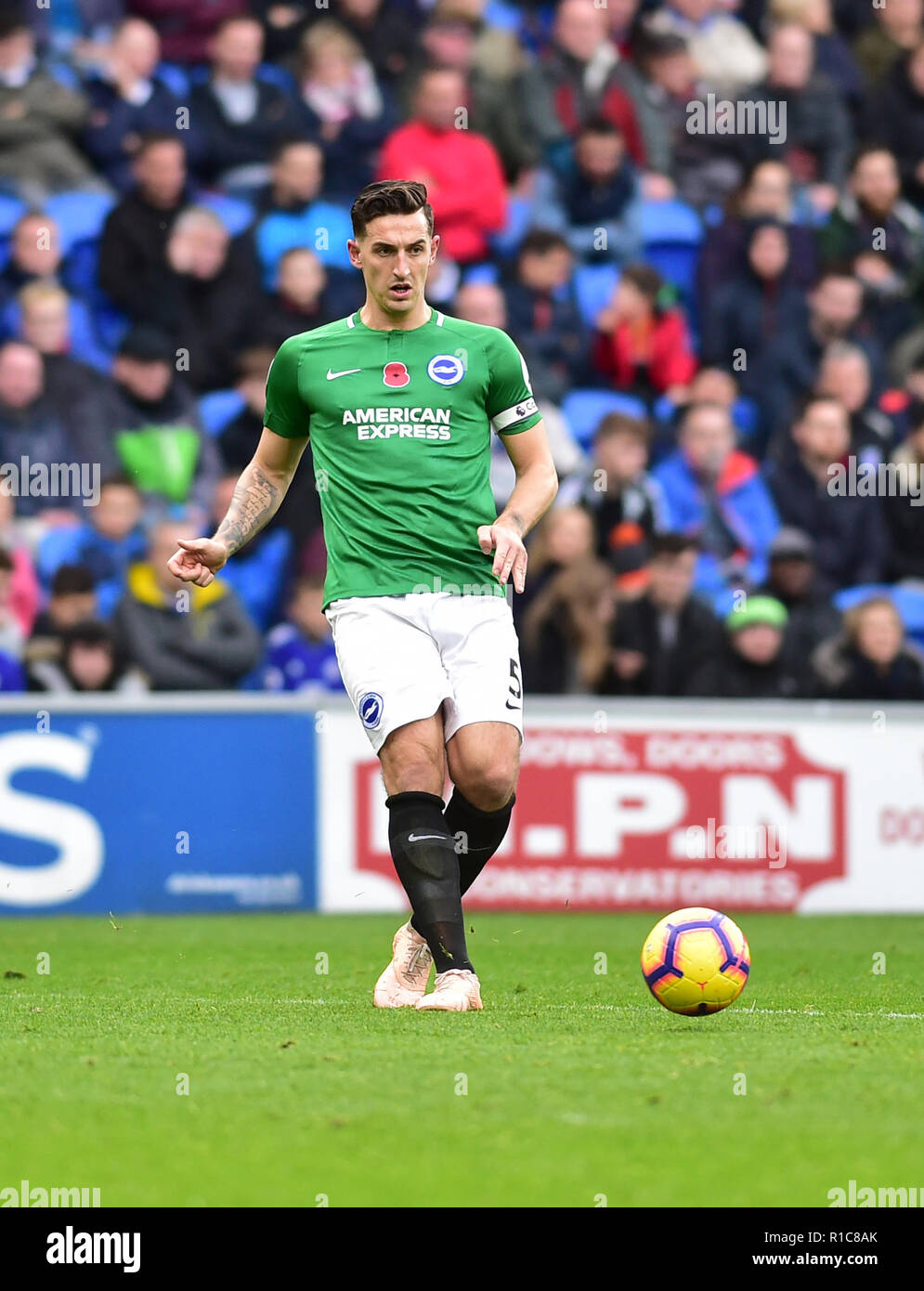Lewis Dunk of Brighton during the Premier League match between Cardiff City and Brighton and Hove Albion at the Cardiff City Stadium . 10 Nov 2018 Editorial use only. No merchandising. For Football images FA and Premier League restrictions apply inc. no internet/mobile usage without FAPL license - for details contact Football Dataco Stock Photo