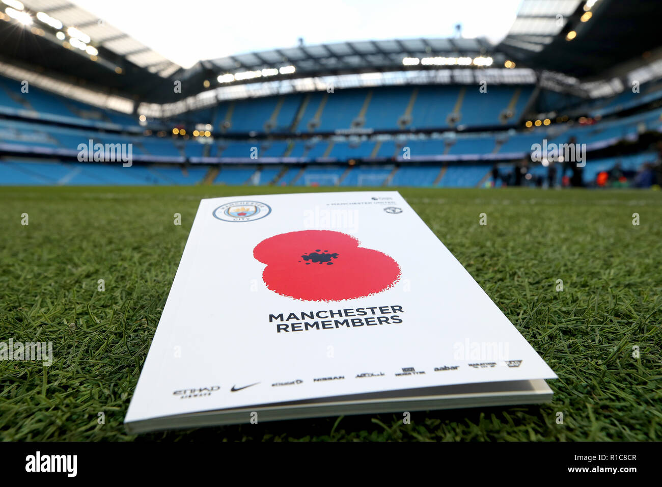The matchday programme for the Manchester derby with a poppy for Remembrance Sunday during the Premier League match at the Etihad Stadium, Manchester. Stock Photo