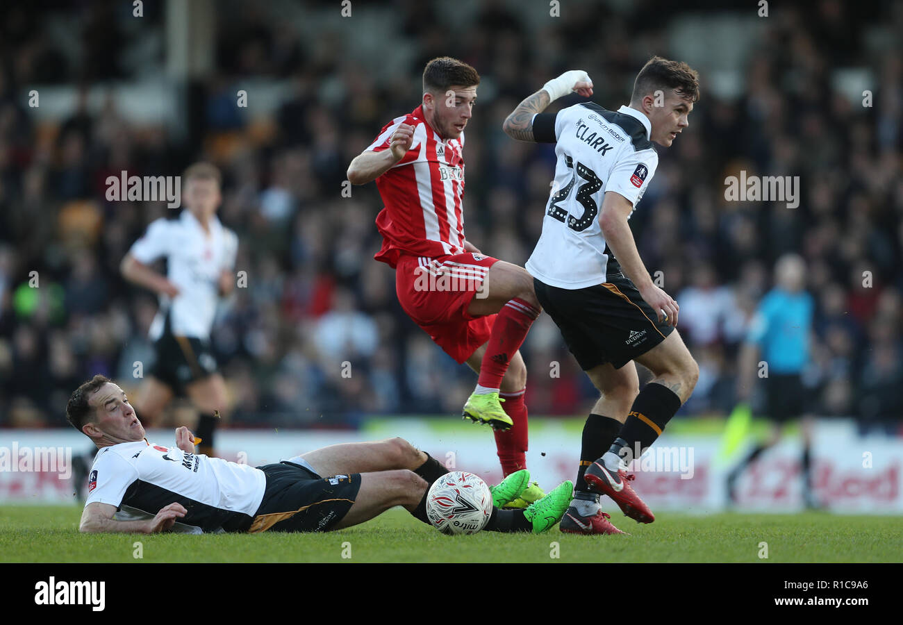 Sunderland's Lynden Gooch is tackled by Port Vale's Luke Joyce and Mitchell Clark during the Emirates FA Cup, first round match at Vale Park, Stoke. Stock Photo