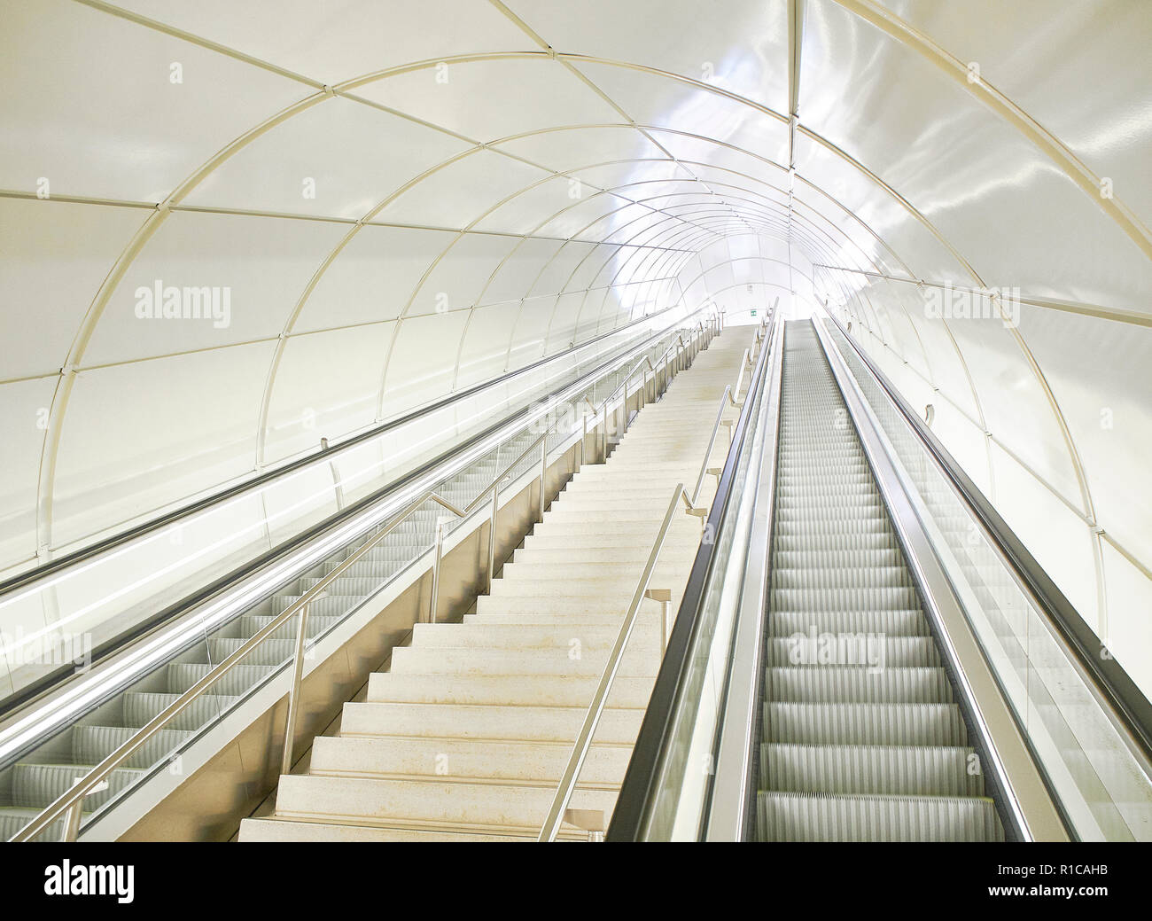 Escalators in a tunnel of a modern underground Metro station Stock ...