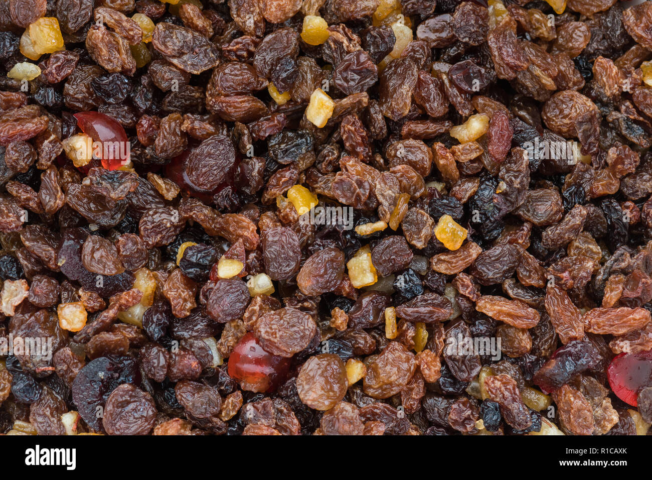 dried fruits soaking in alcohol for christmas fruitcake Stock Photo