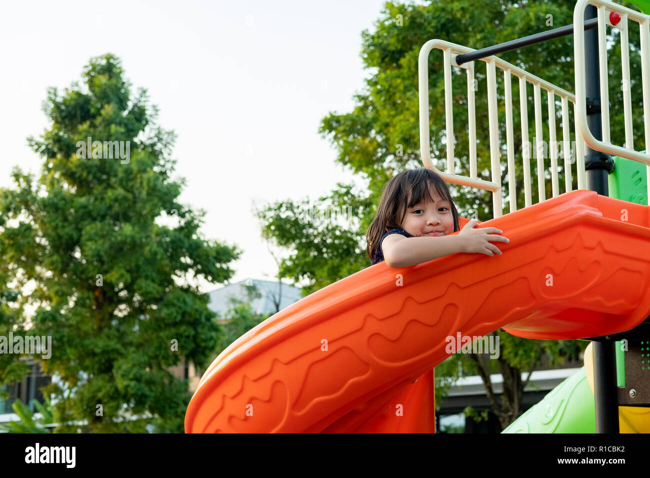 Smiling Little Girl having Fun on Playground Stock Photo - Alamy
