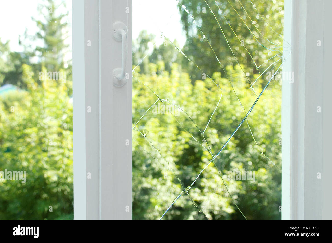 Broken glass on a wooden window frame Stock Photo - Alamy