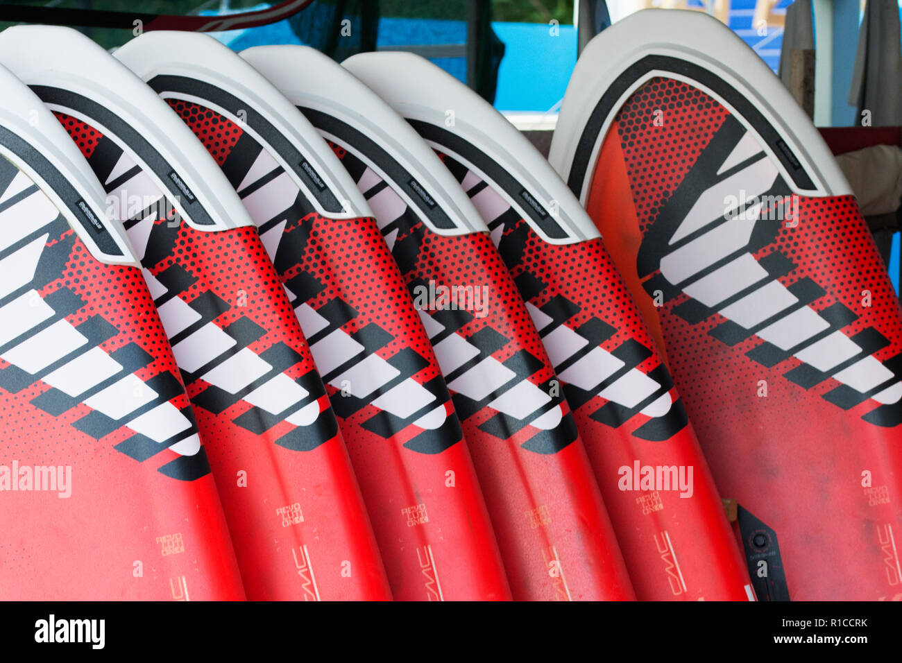 A bunch of red and white windsurfing boards Stock Photo