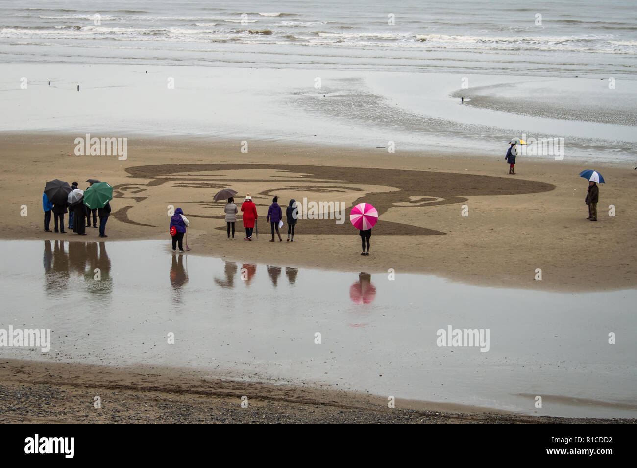 A portrait of John McCance, created on the beach at Murlough in Northern Ireland to mark 100 years since the end of World War One. Stock Photo