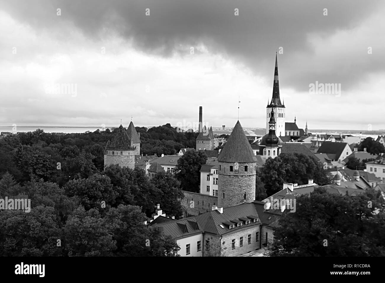 Tallinn city wall and St. Olaf's Church view. Aerial view of Tallinn skyline, Estonia. Black and white filter Stock Photo