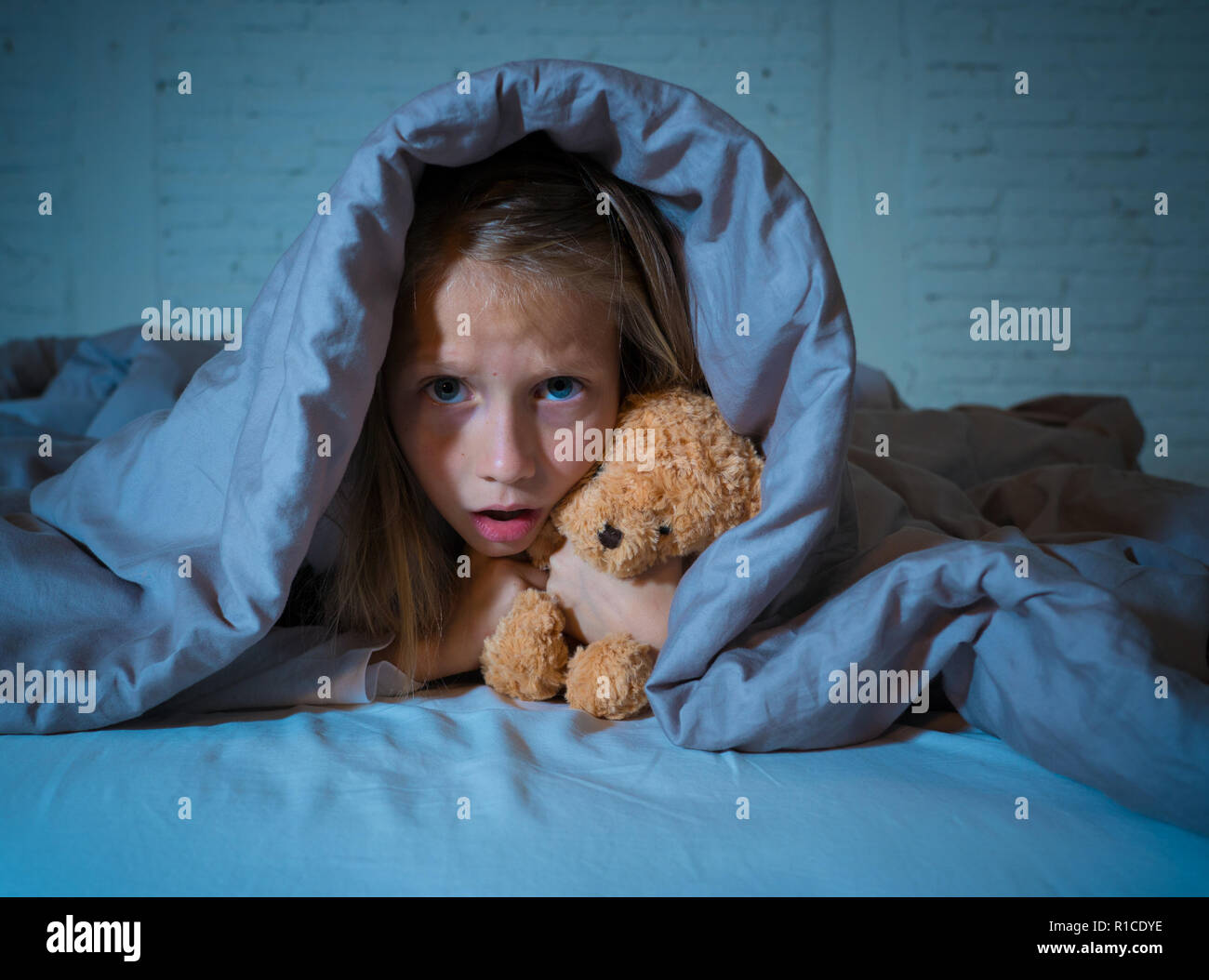 Cute asleep girl screaming and crying after frightening or upsetting