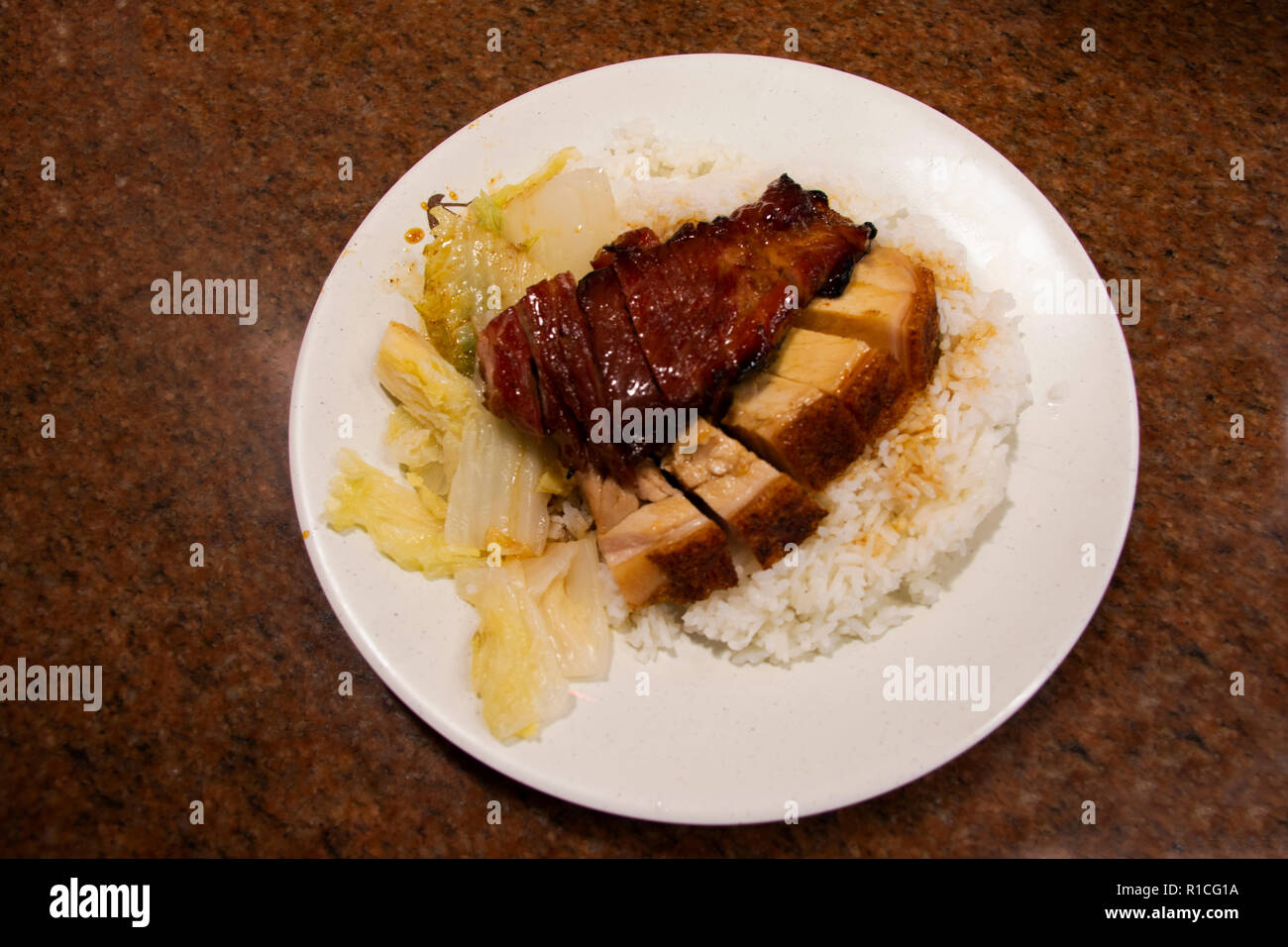 Rice topping roast duck and crispy pork Hong Kong style for sale in
