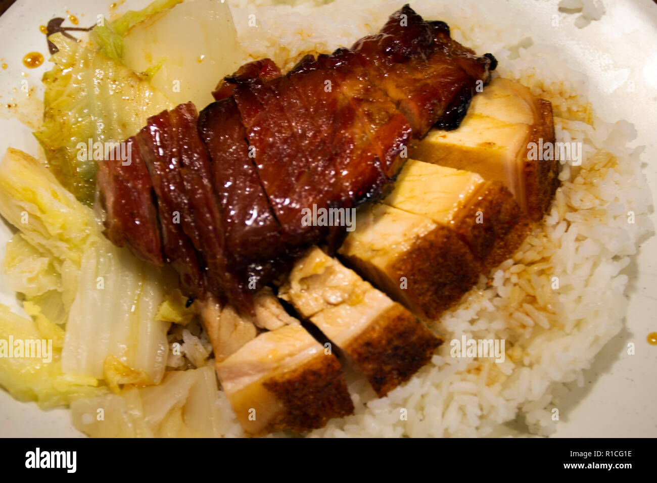 Rice topping roast duck and crispy pork Hong Kong style for sale in