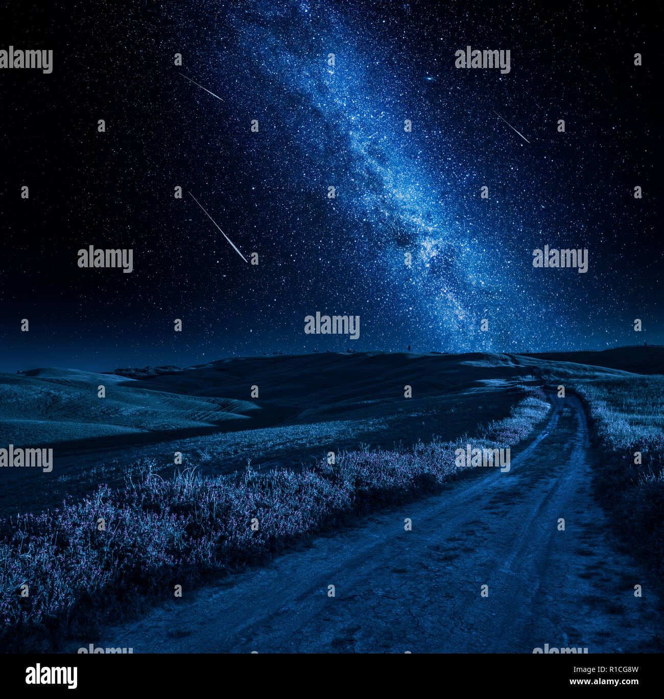 Stunning milky way over country road at night Stock Photo - Alamy