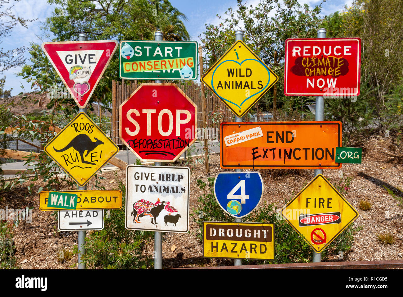 Road traffic signs adapted with environmentally friendly messages, San Diego Zoo Safari Park, Escondido, CA, United States, Stock Photo