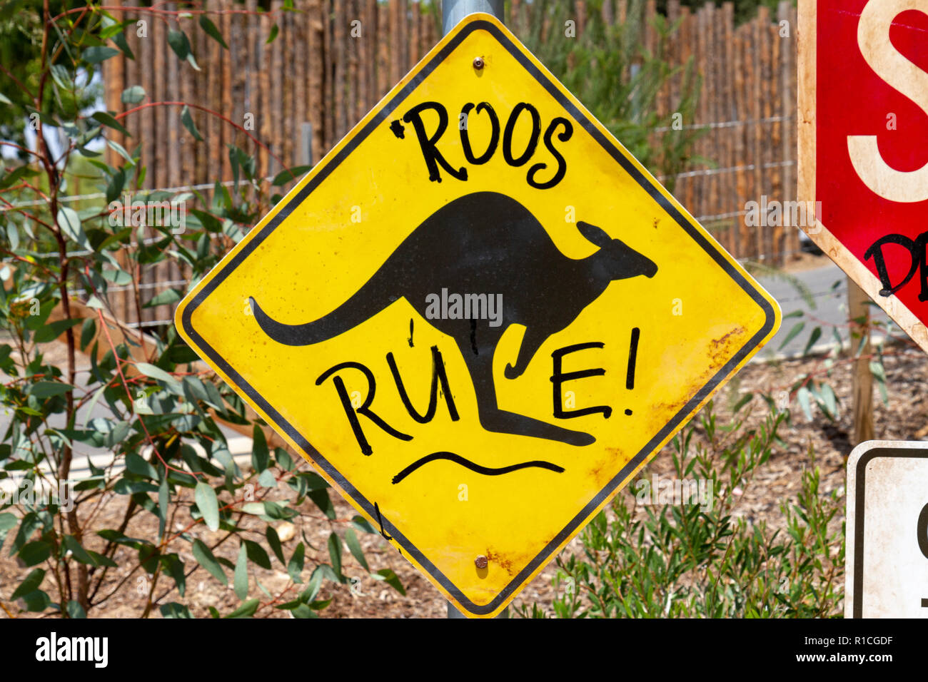 Road traffic sign adapted ('Roos Crossing') with environmentally friendly message, San Diego Zoo Safari Park, Escondido, CA, United States, Stock Photo