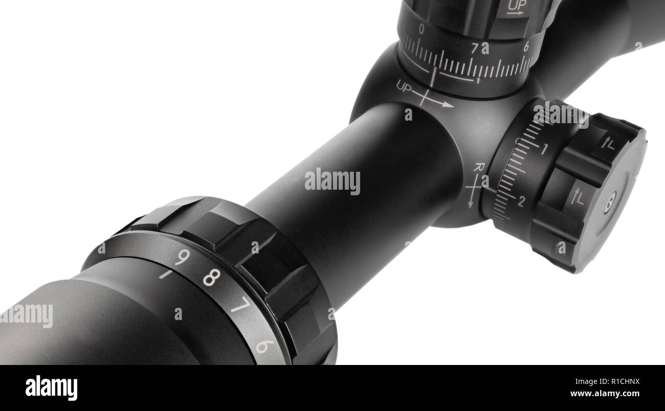 Magnification dial and adjustment knobs on a sniper scope on white