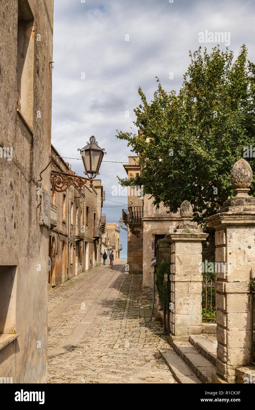 Narrow cobblestone street in the medieval walled town of Erice, Sicily, southern Italy. Stock Photo
