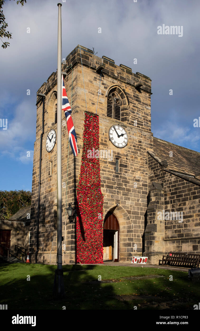 St Peter's Church in Rawdon, Leeds, showing the celebration poppies for the 100th year of the end of the 1914 - 1918 great war. Stock Photo