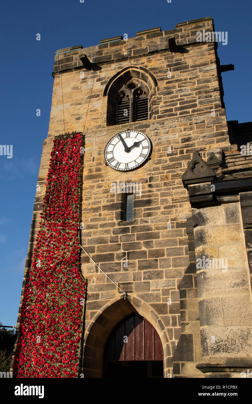 St Peter's Church in Rawdon, Leeds, showing the celebration poppies for the 100th year of the end of the 1914 - 1918 great war. Stock Photo