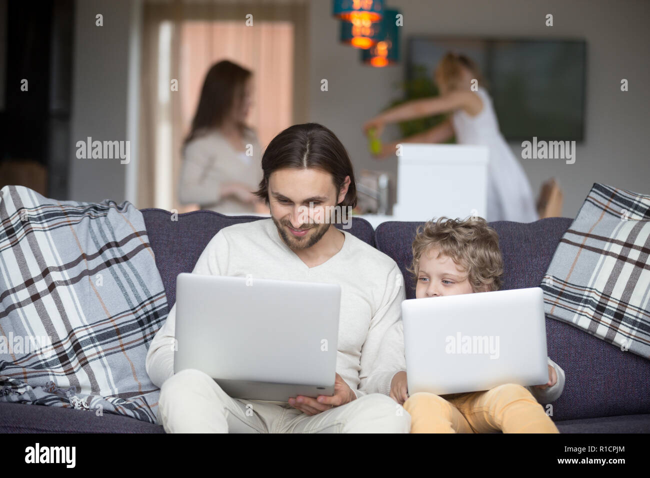 Whole family spend free time together weekend at home Stock Photo