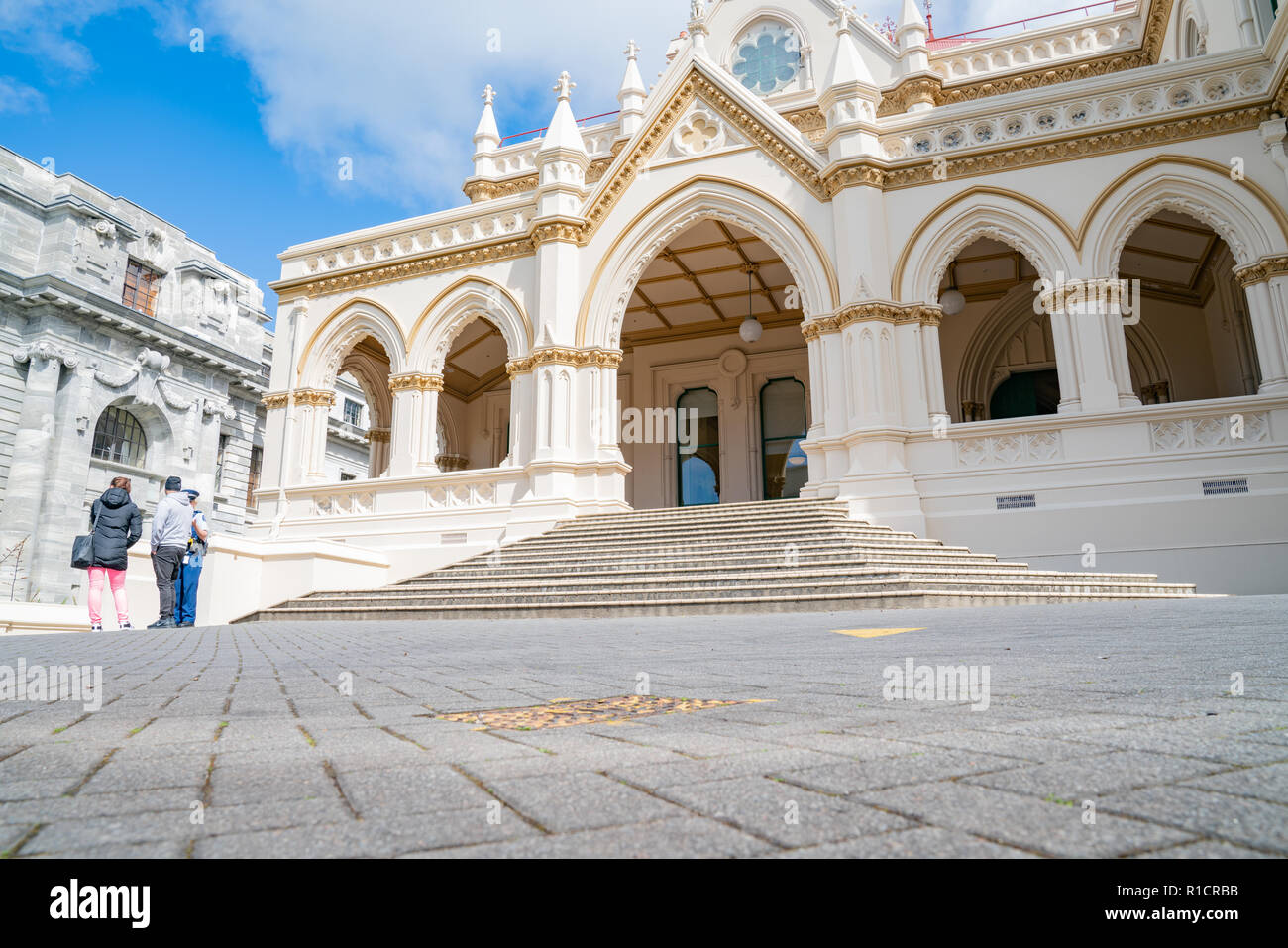 WELLINGTON, NEW ZEALAND - OCTOBER 2 2018; people outside Parliamentary Library Gothic Revival style building one of New Zealand Government buildings o Stock Photo