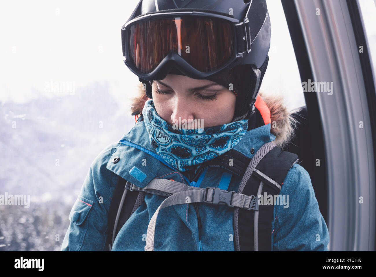 Happy girl on ski resort. Snowboarder on vacation. Lifestyle Concept Adventure winter physical activities. Stock Photo