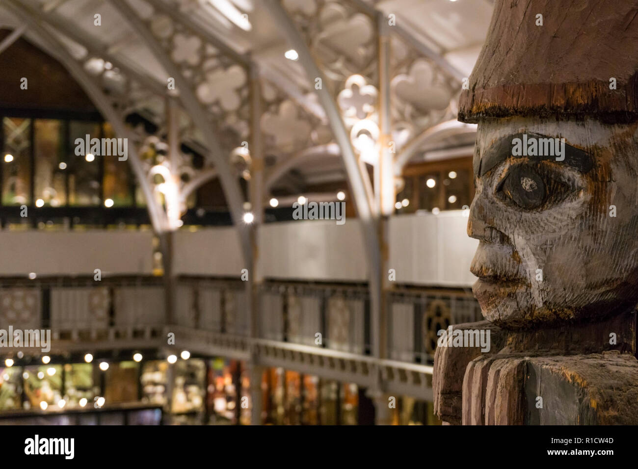 One of the seated figures or watchmen on top of the Haida totem pole in the Pitt-Rivers museum, Oxford. Stock Photo