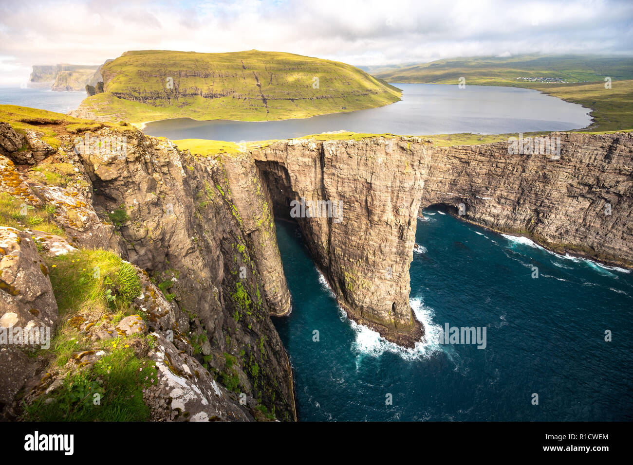 Sorvagsvatn or Leitisvatn infinity lake above the Ocean, Faroe Islands Stock Photo