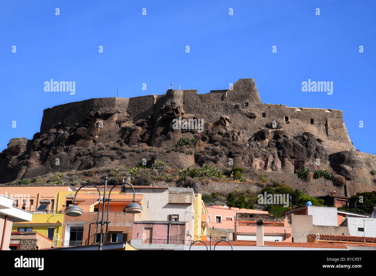 CASTELSARDO, ITALY SEPTEMBER 12, 2018 pastelcolored houses and the